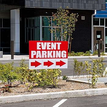 Red event parking sign with arrows placed outside a building