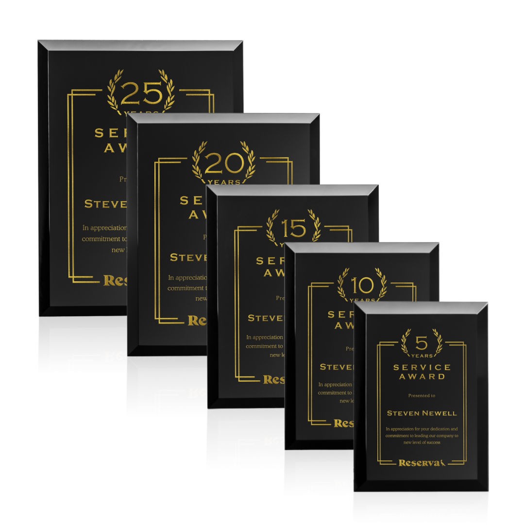 Employee recognition plaques set with engraved titles.