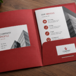 Open red presentation folder with brochures, business documents and business card slot